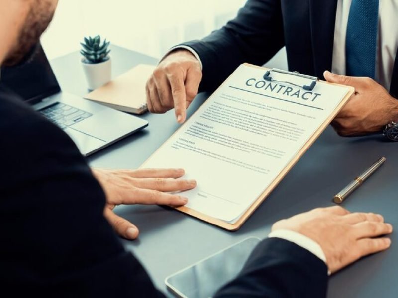 man-suit-is-pointing-document-that-says-contract_31965-188834